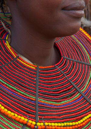 A pokot woman wears large necklaces made from the stems of sedge grass, Baringo county, Baringo, Kenya, Africa (photo)