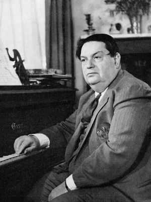 Darius MILHAUD - seated