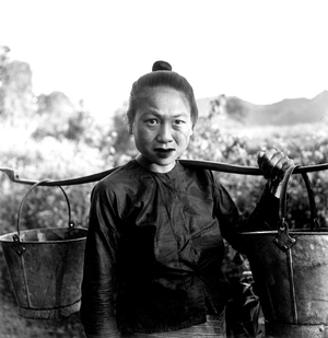 Laos: Meo population1952-1955: a water carrier (b/w photo)