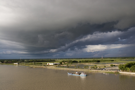 Storm clouds over Rupsha Bridge. Rupsha, Khulna, Bangladesh. July 27, 2006.  (photo)