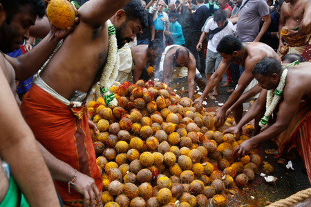 Ganesh festival in Paris, France. Coconut smashing. (photo)