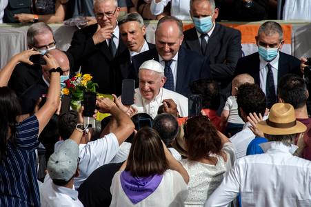 Pope Francis arrives at San Damaso courtyard in the Vatican for his weekly outdoors general audience.
(photography)