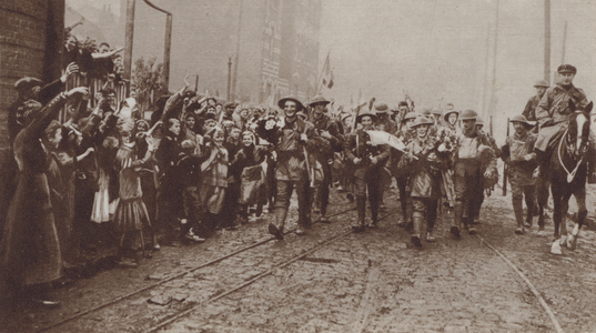 British troops of the Liverpool Irish receiving a warm welcome from the people of the recaptured town of Lille, World War I, 18 October 1918 (b/w photo)