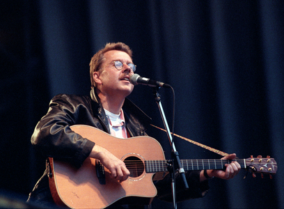 Bærum 19910706. Mikael Wiehe with guitar on stage during the concert at the Kalvøya festival …, 1991 (photo)
