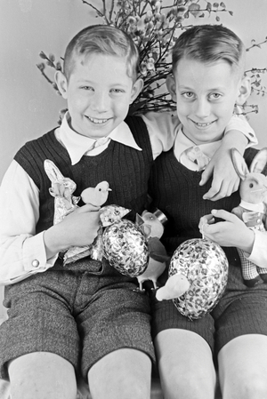 Two boys at a table with easter decoration, Germany 1930s (b/w photo)