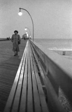 At Coney Island amusement park, Pier at Dusk, 1950 (photo)
