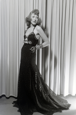 A model trying a dress of fashion designer Hilda Romatzki, Germany ca.1939 (b/w photo)