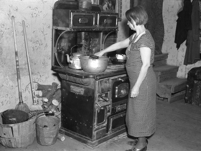 Mrs. Erasty Emrich in her kitchen, Near Battle Ground, Indiana, 1937 (b/w photo)
