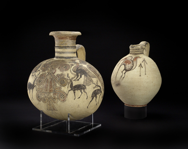 Bichrome IV barrel-shaped Cypro-Phoenician jug, and Phoenician vase with sacred tree, stags, crested birds and lotus flowers (ceramic)