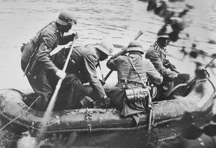 Stormtroopers cross the Meuse in a rubber dinghy, France, 1940 (b/w photo)