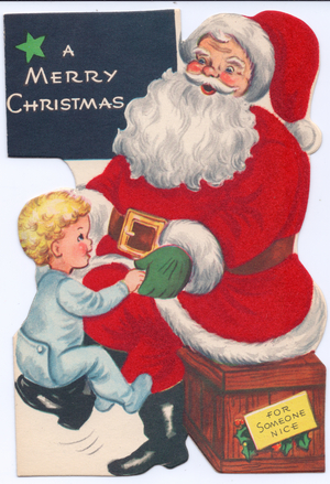 A die-cut Xmas Card of Father Christmas with a small boy, his costume covered with red flocking, circa 1910 (coloured lithograph)