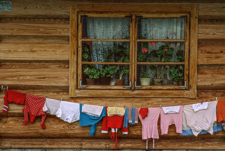 Laundry hanging out to dry below a window. Zab, Poland., 1980s (photo)