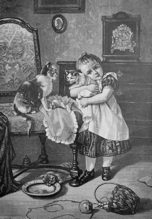 Child hugs young cat