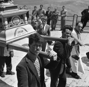 Religious PROCESSION in Albano di Lucania, the young men who have the honor of acting as bearers of one of the three sacred statues displayed in a motorcade, the one representing Saint Michael the Archangel defeating Satan