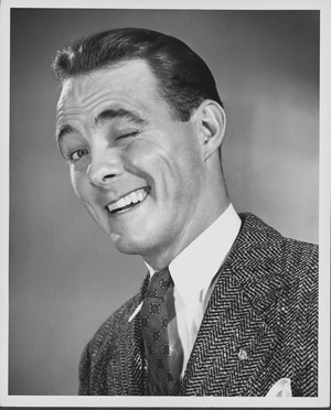 Close-up of a businessman winking and smiling