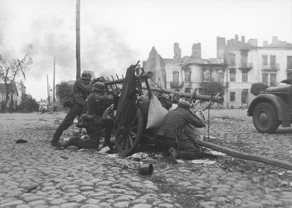 German Soldiers Using a Wagon as Cover in a Fire Fight, 1942 (b/w photo)