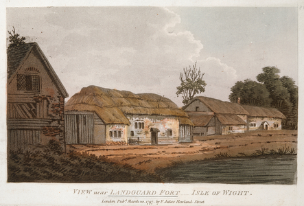 Buildings on the left; a road in front; a body of water on the right