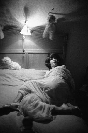 A Berlin stripper settles down for a quiet night, Berlin, Germany, 1960 (photo)