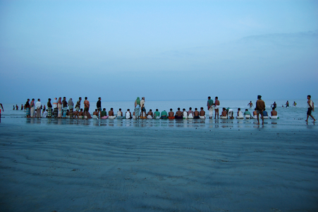 People from the Hindu community have gathered for the holy bath known as Gangasnan, at the auspicious time of the annual Makar Sankrnati, at Dublar char, in Khulna, Bangladesh. After the holy bath they offer prayer to Lord Surya, the Sun God. The holy dip is believed to wash the sins away and lead to the attainment of Nirvana. November 13, 2008.  (photo)