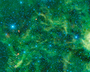The star cluster NGC 2259 is overshadowed by the surrounding stars and dust which glow brightly in infrared light. WISE.