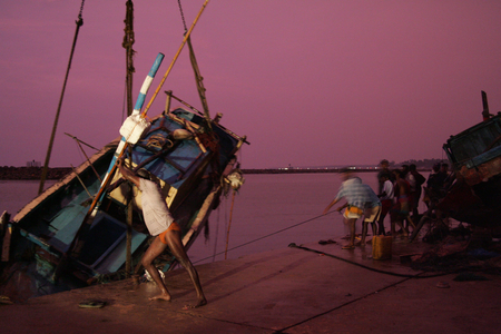 4th January 2005: Fishermen worked through the night to rescue stranded boats in Hikkadua. Sri Lanka Tsunami.  (photo)