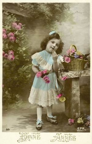 New Year card with little girl in blue (colour photo)
