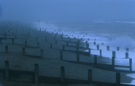 The beach and its breakwaters at dusk in winter with a stormy North Sea, Aldeburgh, Suffolk (photo)