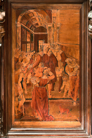 Genoa, Duomo (St Lawrence Cathedral), inside, presbitery, apse, choir, North side: "The Charity of St Lawrence", wood intarsia by Gian Michele De' Pantaleoni or Anselmo de' Fornari (XVI century)