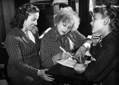 Colette at Home With Jacqueline Audry and Daniele Delorme, Signing A Contract For The Film Adaptation of her Novel Gigi, September 22, 1948 (b/w photo)