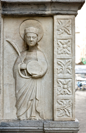 Genoa, Duomo (St Lawrence Cathedral, south side: "wall tomb of Antonio Grimaldi - detail with a pilgrim figure holding the palm and the wheel of martyrdom ", after 1402