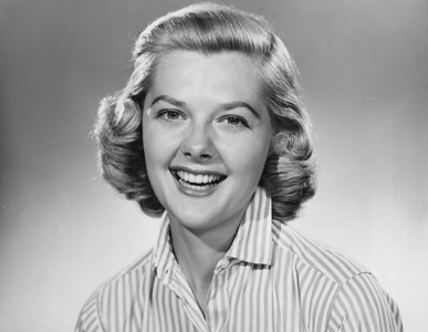 Studio portrait of young woman smiling