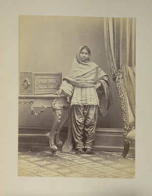 Portrait photograph of a Hindu girl from Sindh, showing method of wearing ear and nose rings, wristlets and anklets.