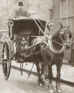 A Hansom Cab in London, England in 1910.  From The Story of 25 Eventful Years in Pictures, published 1935.