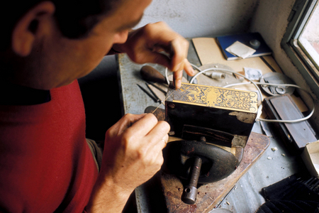 Craftsman makes wooden boxes with traditional Spanish gold ornaments..., 1985 (photo)