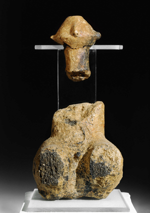 Sitting male clay figurine (clay)