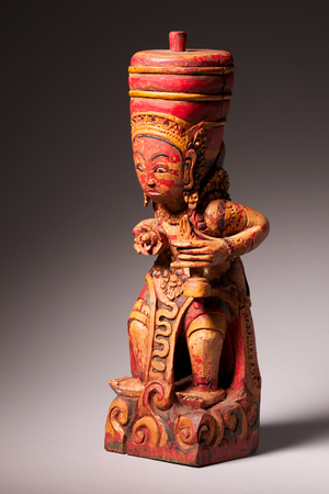 Carved and painted wooden priest, Bali