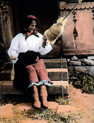 Romanian farm woman processing flax