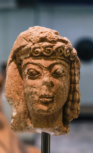 Female head with ribbon on forehead, Crete, 6th century BC (photo)