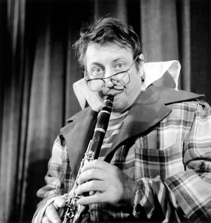 French Humorist Raymond Devos on Stage For Show in Paris November 19, 1961 (b/w photo)