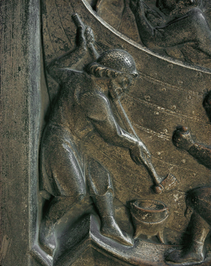 Workmen caulking a ship's hulk, 13th century (stone relief)