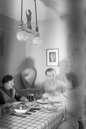 The racing driver Hermann Lang having lunch with his family, Germany 1930s (b/w photo)