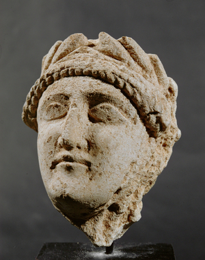Limestone head of a man with laurel wreath, 3rd-2nd BC (limestone)