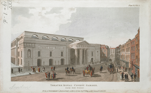 The east front of Theatre Royal from Bow Street; figures standing beneath the entrance portico and on the street; nearby buildings and shop fronts to the right of the theatre.