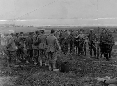 Soldiers Taunting Prisoners of War, 1916 (b/w photo)