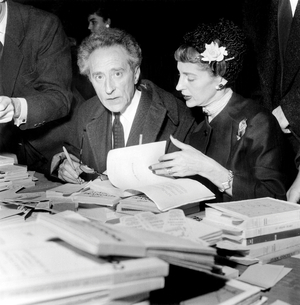 Jean Cocteau, With Friend Francine Weisweiller, Signing Book at The National Writers Committee Fair November 11, 1955 (b/w photo)