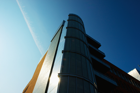 Low angle view of a modern building and a blue sky, Hamburg, Germany (photo)