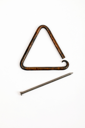 Ornate hand-beaten bronze Triangle with decorative curled or curved lower point, Nail beater, Baroque, renaissance