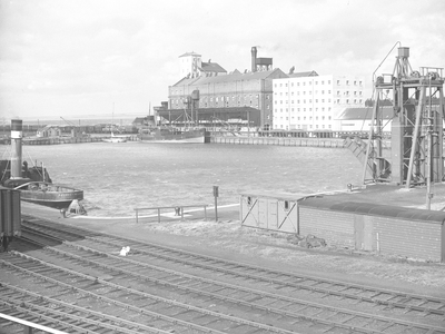 View of sidings, dock, tug and dock buildings, 1930s-60s (b/w photo)