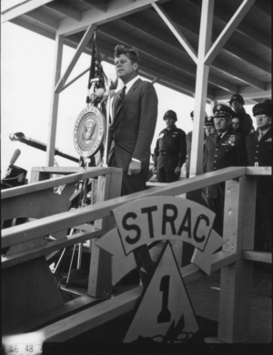President John F Kennedy, while touring build-up units in the Southeast United States, addressed the men of the 1st Armored Division staged at Ft Stewart, Ft Stewart, GA, 11/26/1962 (b/w photo)