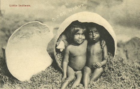 Two children hatching from an egg (b/w photo)